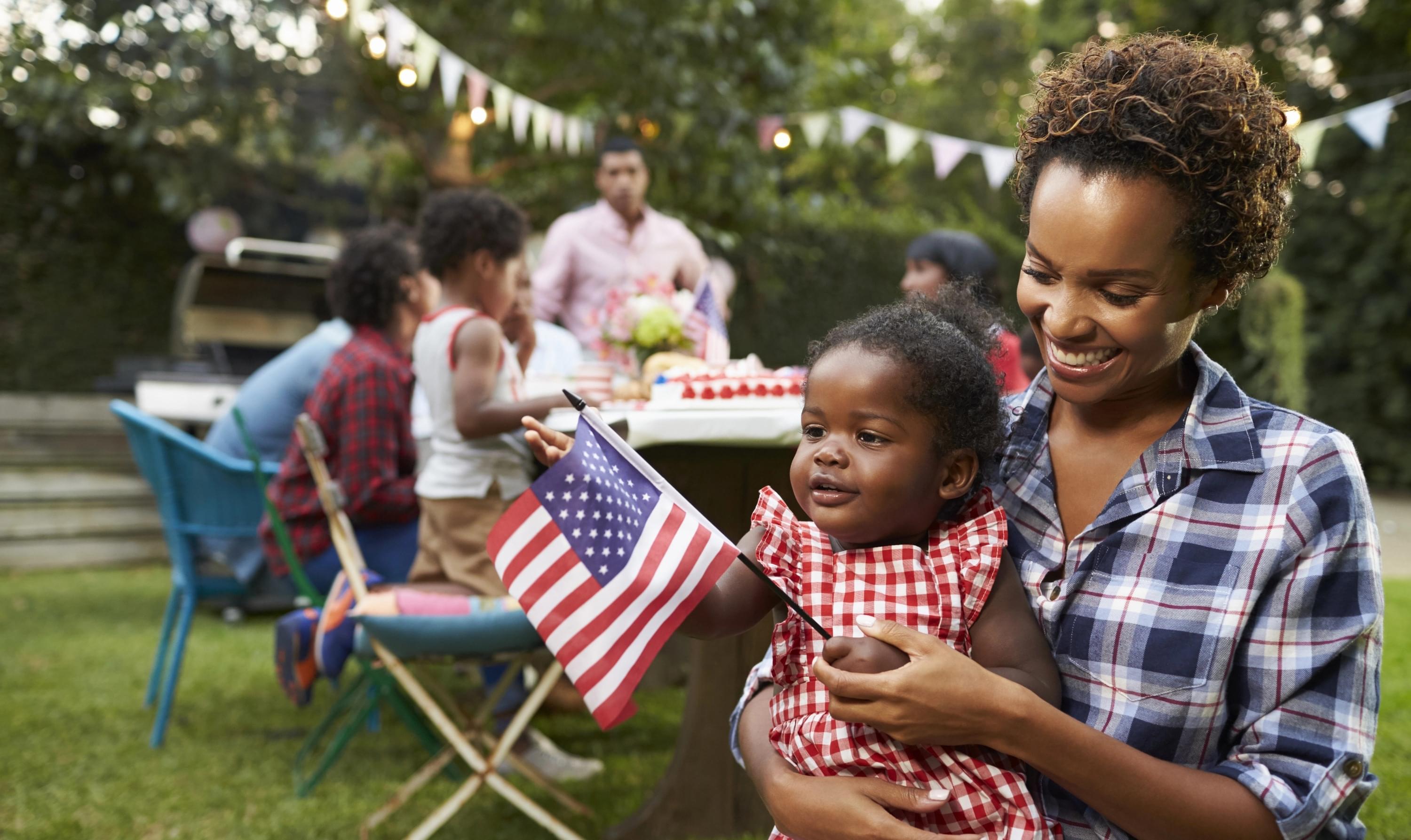 Immigrant family with an American Flag